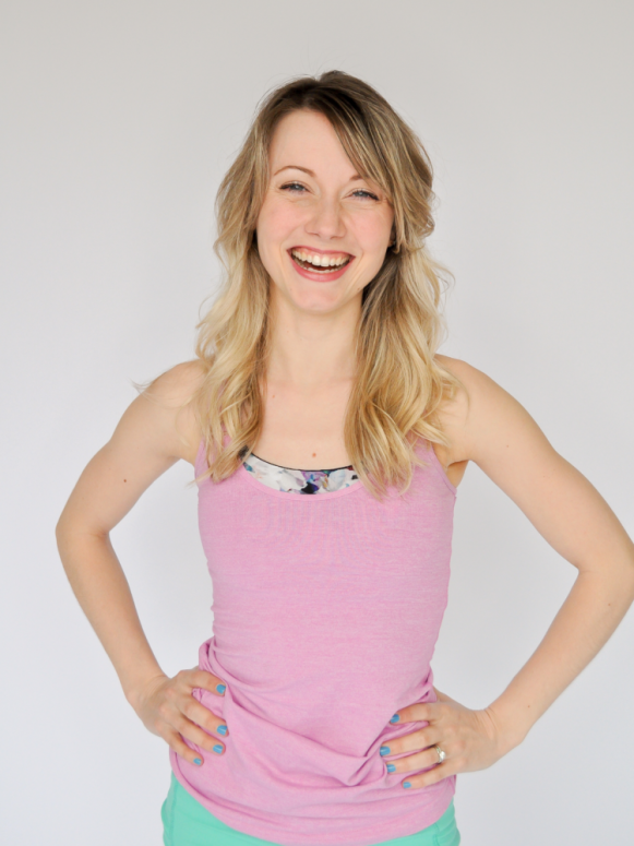 Heidi friese, owner of Move With HPA for dancers headshot in pink tank top dance shirt