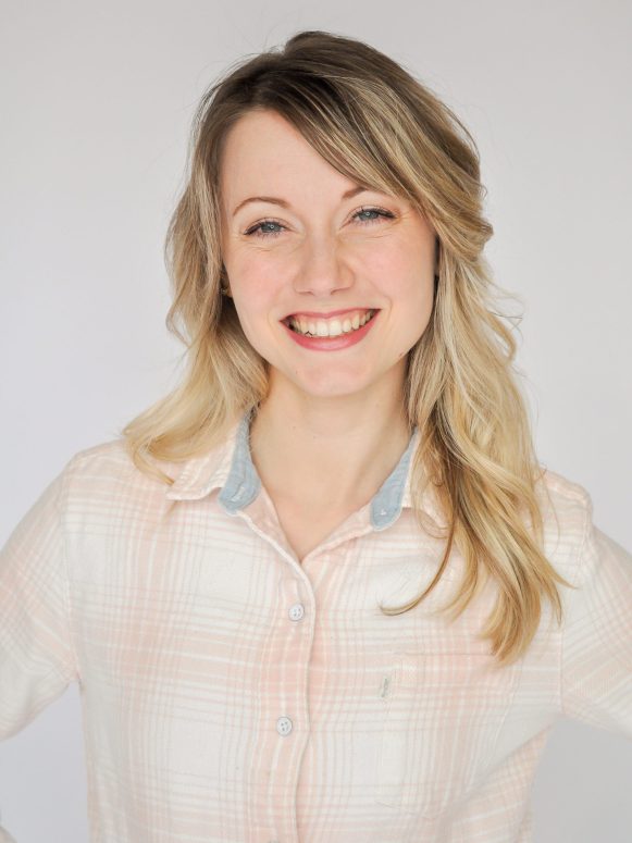 Move With HPA For Dancers founder Heidi Friese headshot in pink plaid button down shirt